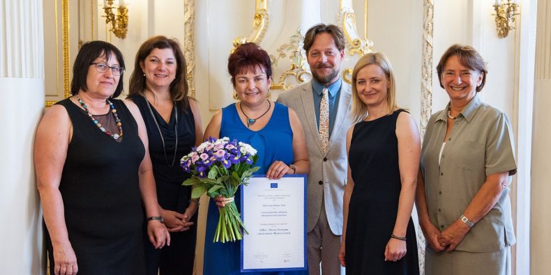 The main person behind the project Ivana Rešková (in the middle) receiving the European Language Label 2017.